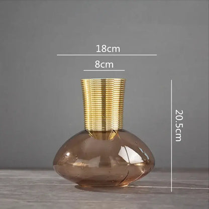 A sleek amber glass metal glass vase with textured gold metal neck for modern teal and amber gold metal decorbites decor