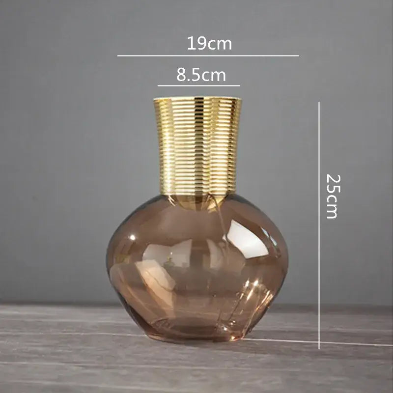 A sleek amber glass metal glass vase with a textured gold metal neck for modern living room decorbites gold metal decor