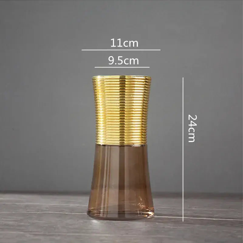 A modern teal and amber gold metal glass vase with a gold metal ribbed top for elegant living room decorbites decor