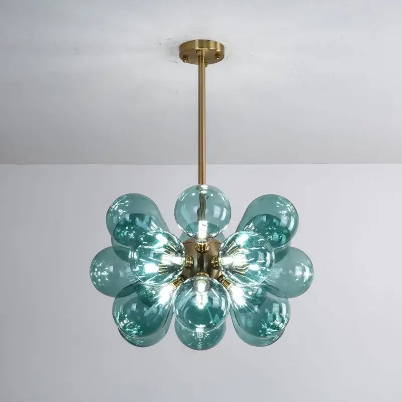 Modern teal and gold glass bubble hanging pendant light featuring brass finish and floral pattern for dining room decorbites glass bubble