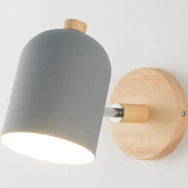Modern teal and wood wall lamp featuring a gray matte cylindrical sconce with natural wood base and accents for bedroom use