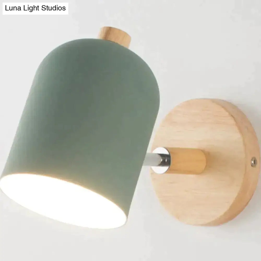 Modern teal and wood wall lamp with a matte sage green ceramic shade and natural wood base for bedroom sconce lighting
