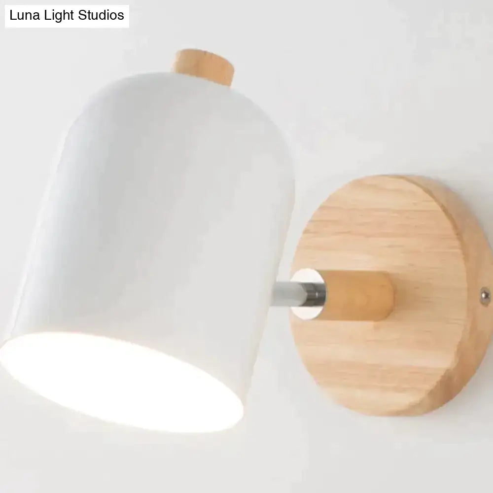 Modern teal and wood wall lamp featuring a white ceramic lamp with wooden base and accent pieces for bedroom use