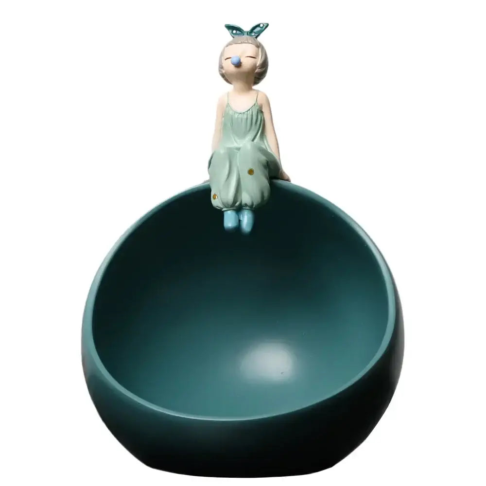 Modern teal bowknot girl figurine made of matte resin with butterfly ears atop a matching spherical storage bowl