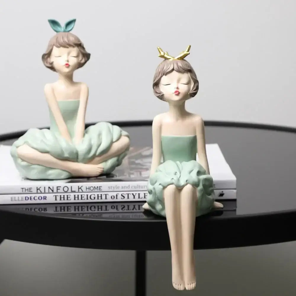 Two mint-green resin bowknot girl figurines with bunny ears and gold antlers for modern living room decor