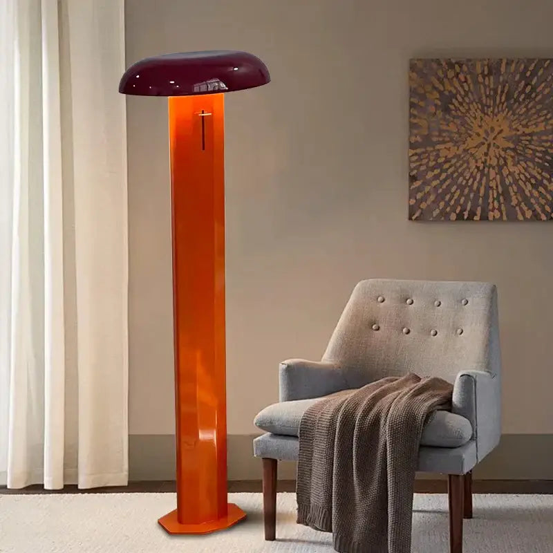 A sleek translucent orange floor lamp with a glossy burgundy decorbites designer mushroom shade for living room decor