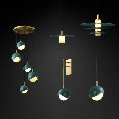 Modern teal glass and brass pendant light with globe design for kitchen island featuring decorbites blue copper accents