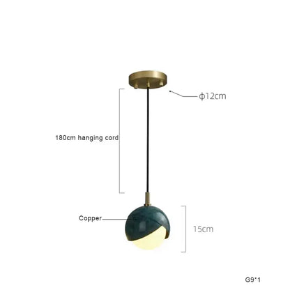 Modern teal glass and brass pendant light with a sleek half-spherical design for kitchen island decorbites blue copper