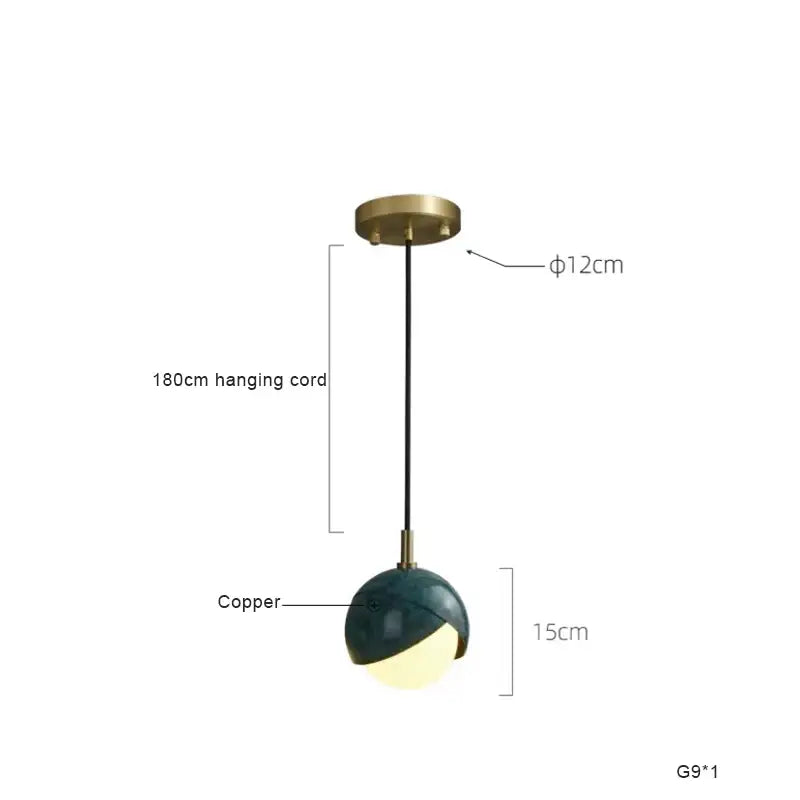 Modern teal glass and brass pendant light with a sleek half-spherical design for kitchen island decorbites blue copper
