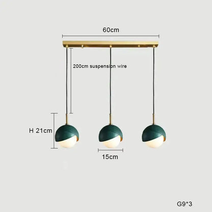 Modern pendant light with dark green and white glass shades suspended from a brass bar ideal for kitchen island decorbites blue copper chandelier