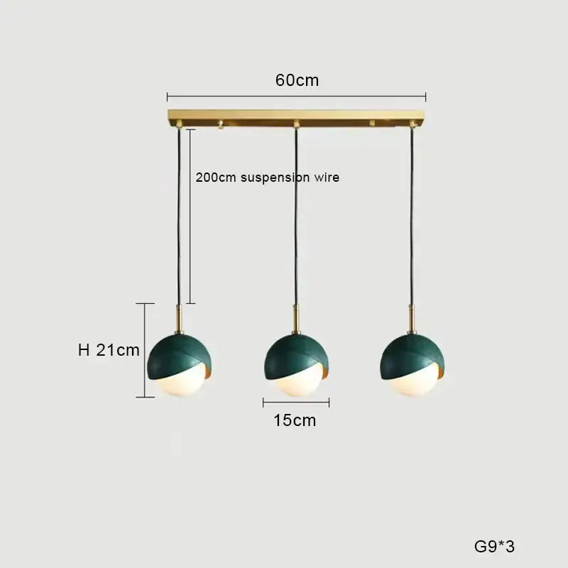 Modern pendant light with dark green and white glass shades suspended from a brass bar ideal for kitchen island decorbites blue copper chandelier
