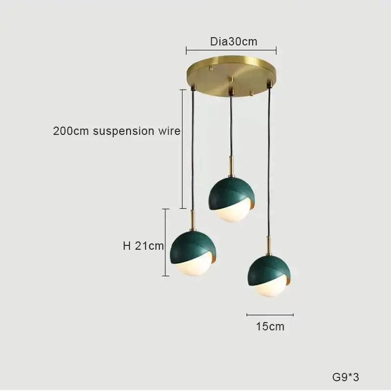 Modern pendant light with brass ceiling mount and dark green shades over white globe bulbs ideal for kitchen island decorbites blue copper