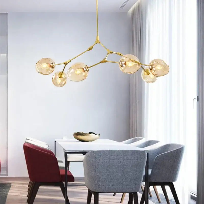 Modern teal glass branch ceiling chandelier with gold-toned finish and six frosted glass globes for dining room decorbites glass branch