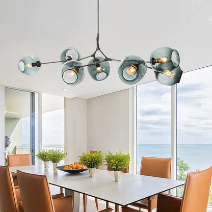 Modern teal glass bubble branch chandelier with black metal arms for dining room decorbites glass bubble lighting