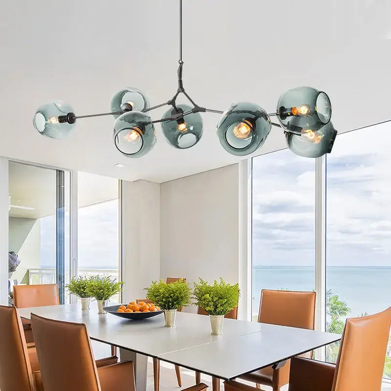 Modern teal glass bubble branch chandelier with black metal arms for dining room decorbites glass bubble lighting