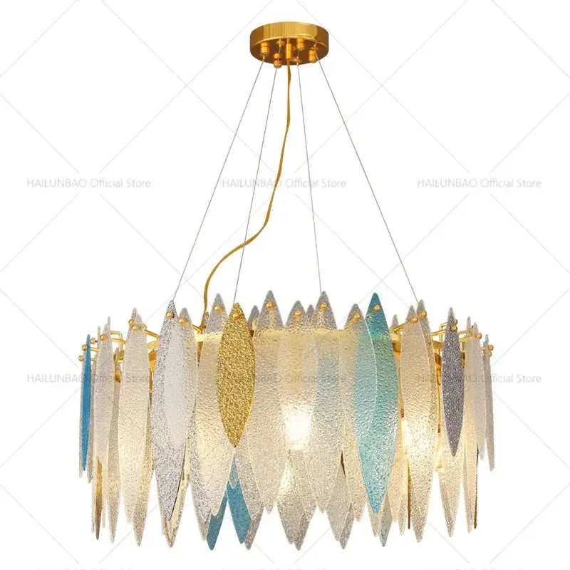 Modern teal and gold glass chandelier light with gold-toned metal frame and fish-shaped glass shades for living room