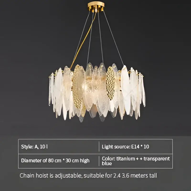 Modern teal and gold glass chandelier light with translucent blue and clear leaf-shaped shades for living room