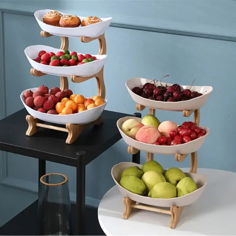 Modern teal and white ceramic layer table plates fruit stand with three tiers and light wood legs for dining room use