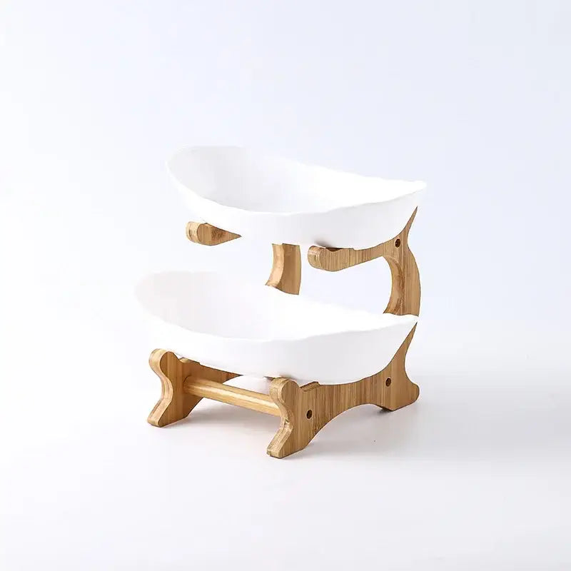 Modern teal and white ceramic layer table plates with a white ceramic bowl set on a bamboo wood stand for dining use