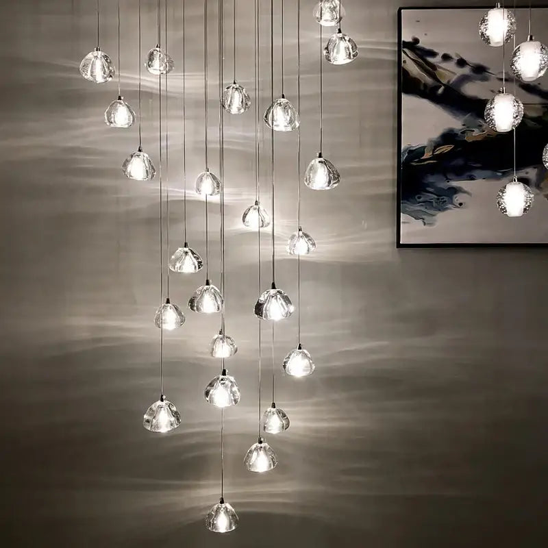Modern teardrop decorbites crystal led chandelier with multiple glass orbs suspended by metallic cords for living room decor