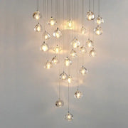 A modern teardrop crystal led chandelier with clear glass pendants by decorbites for living room decorbites crystal led use
