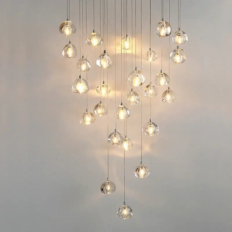 A modern teardrop crystal led chandelier with clear glass pendants by decorbites for living room decorbites crystal led use
