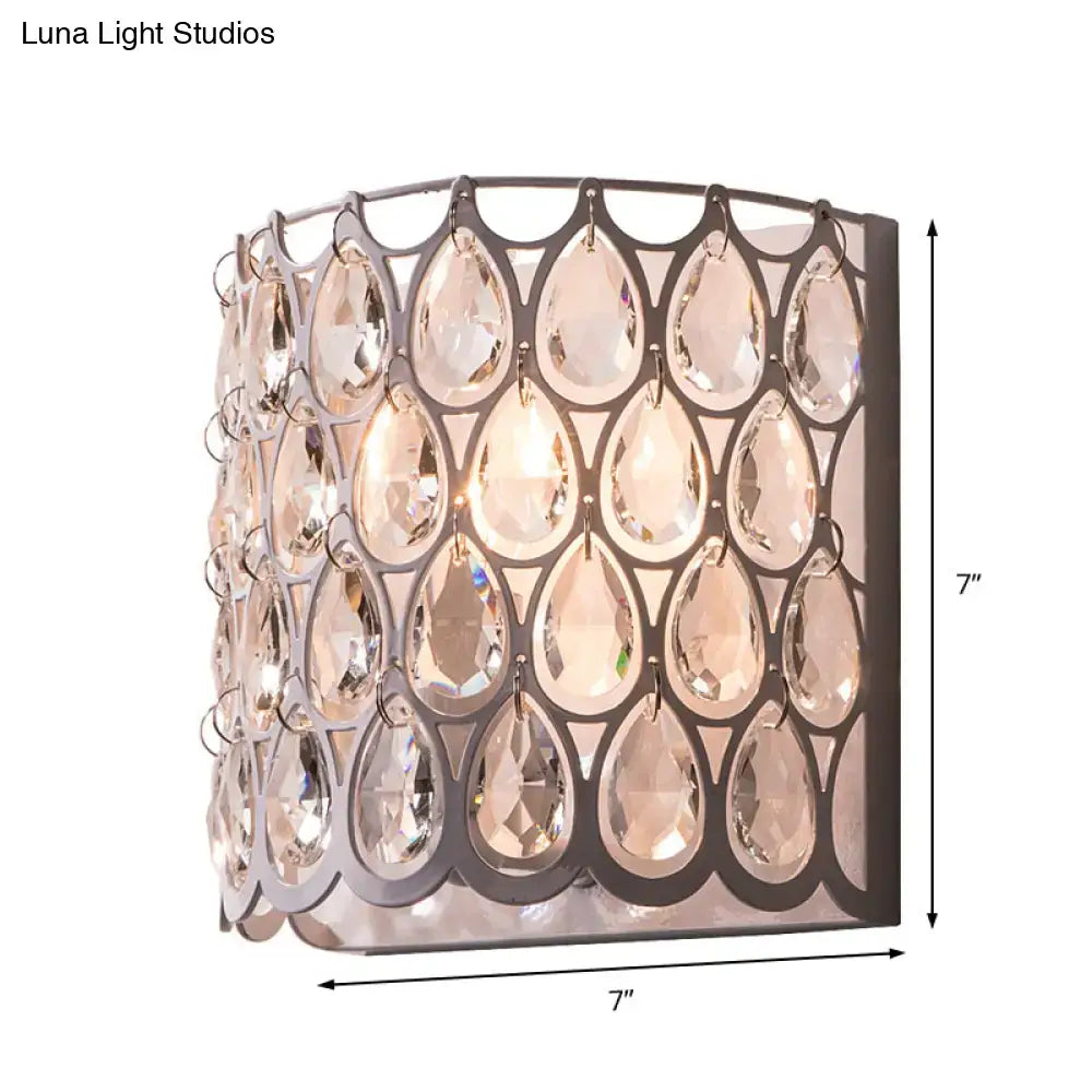 Modern teardrop crystal wall mounted light with dark metal frame and clear crystals for bedroom white sconce