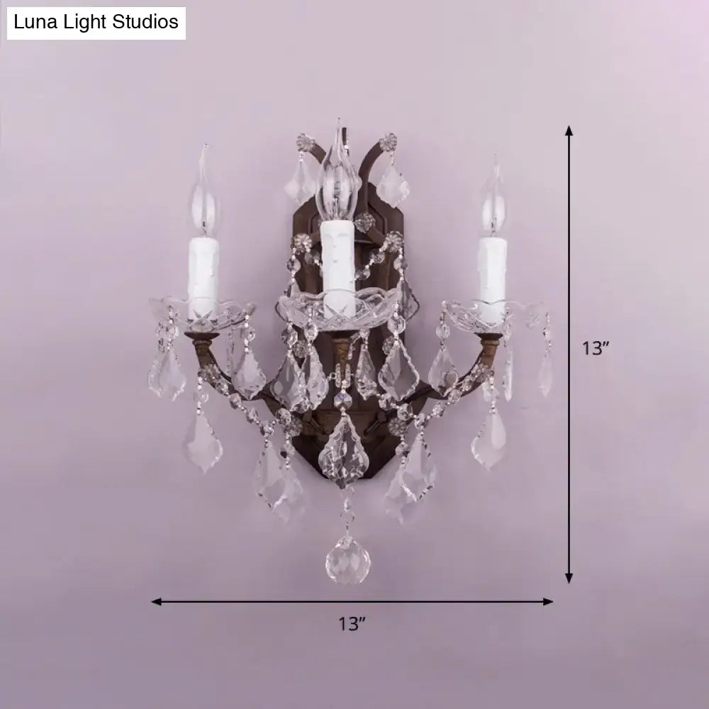 Antique bronze-finished modern teardrop wall lamp with clear crystal droplets for living room lighting
