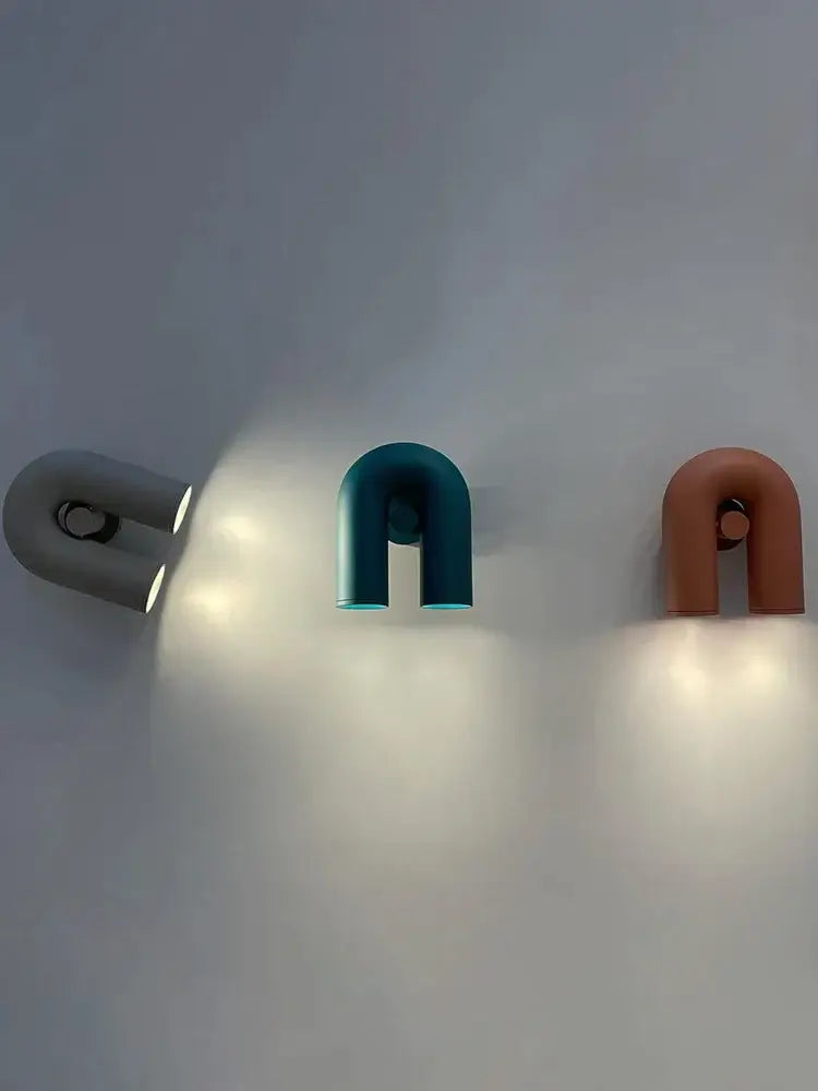 Three modern led u-shaped wall lamps in matte gray teal and terracotta finish for living room staircase lighting