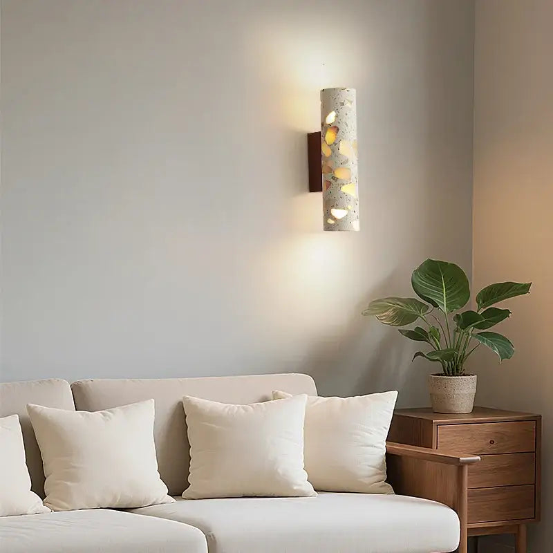 Modern terrazzo concrete led wall sconce with golden accents and dark wood backplate for stylish decorbites led wall lighting