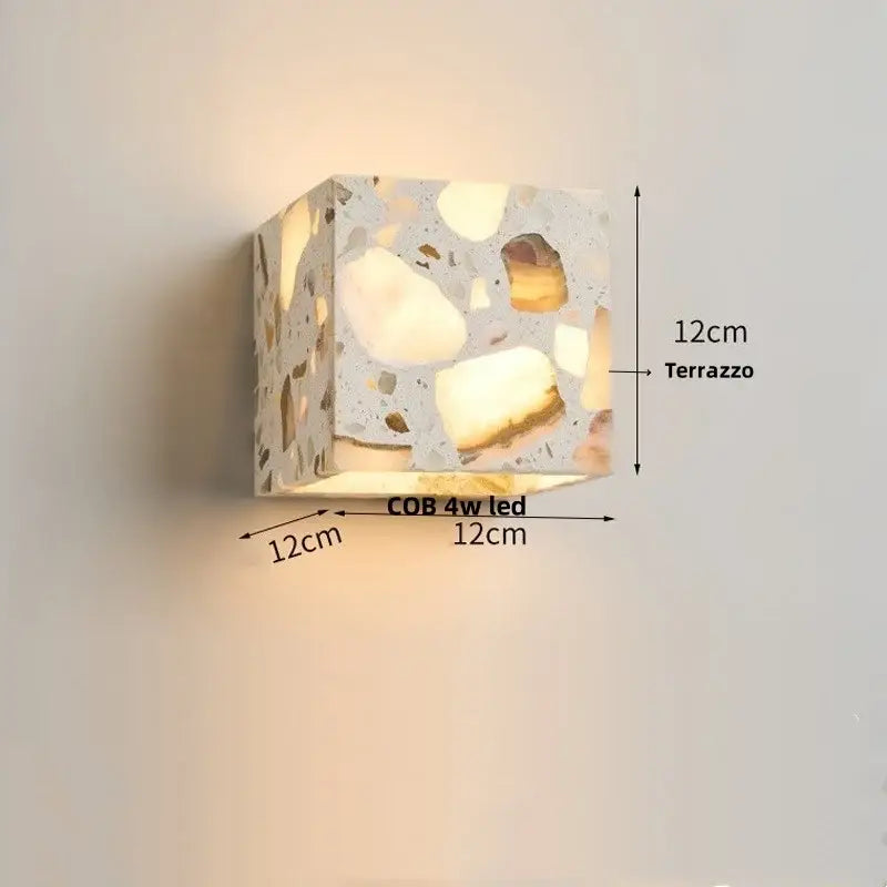 A 12cm cube-shaped modern terrazzo led wall light fixture with textured speckled surface for bedroom decorbites led wall use