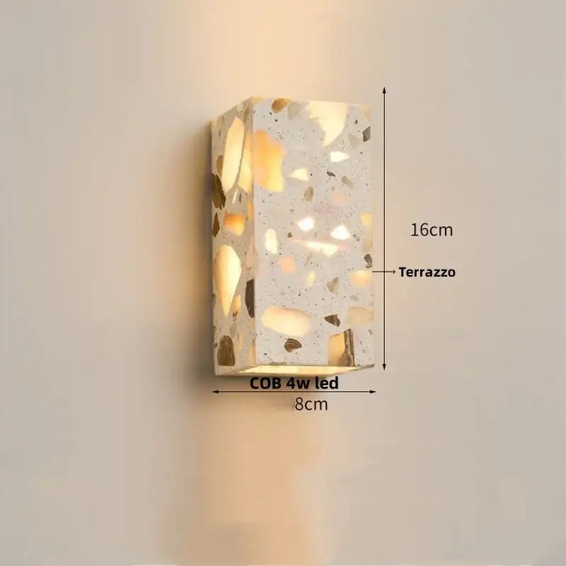 Modern terrazzo cube led wall light fixture featuring a rectangular speckled light gray and gold-toned stone pattern wall light fixture