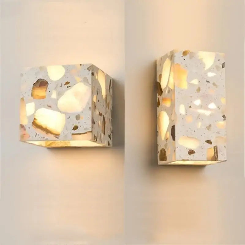 Modern terrazzo cube led wall light fixture with golden and beige stone fragments in light gray decorbites led wall sconce