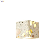 Modern terrazzo cube led wall light fixture with gold and black specks on creamy white base for bedroom decorbites led wall