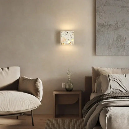 Square terrazzo cube led wall light fixture with speckled white and beige surface modern decorbites led wall sconce