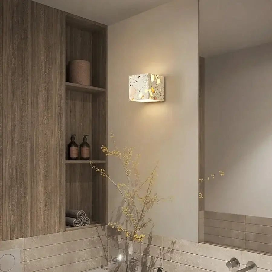 Modern terrazzo cube led wall light fixture with speckled finish and embedded golden and white fragments for decorbites led wall use