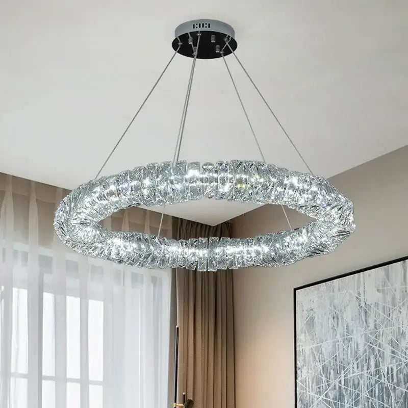 Modern circular pendant lights with textured silver metallic frame and decorbites crystal led for warm dining room illumination
