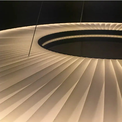 Modern textured dix heures round fabric led pendant light with white ribbed design and black accent ring for dining room