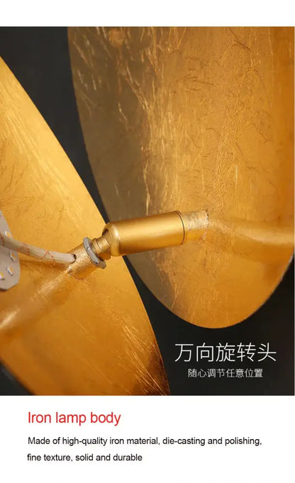Modern textured eclipse round wall lamp with golden iron body polished finish and adjustable rotating head for bedroom
