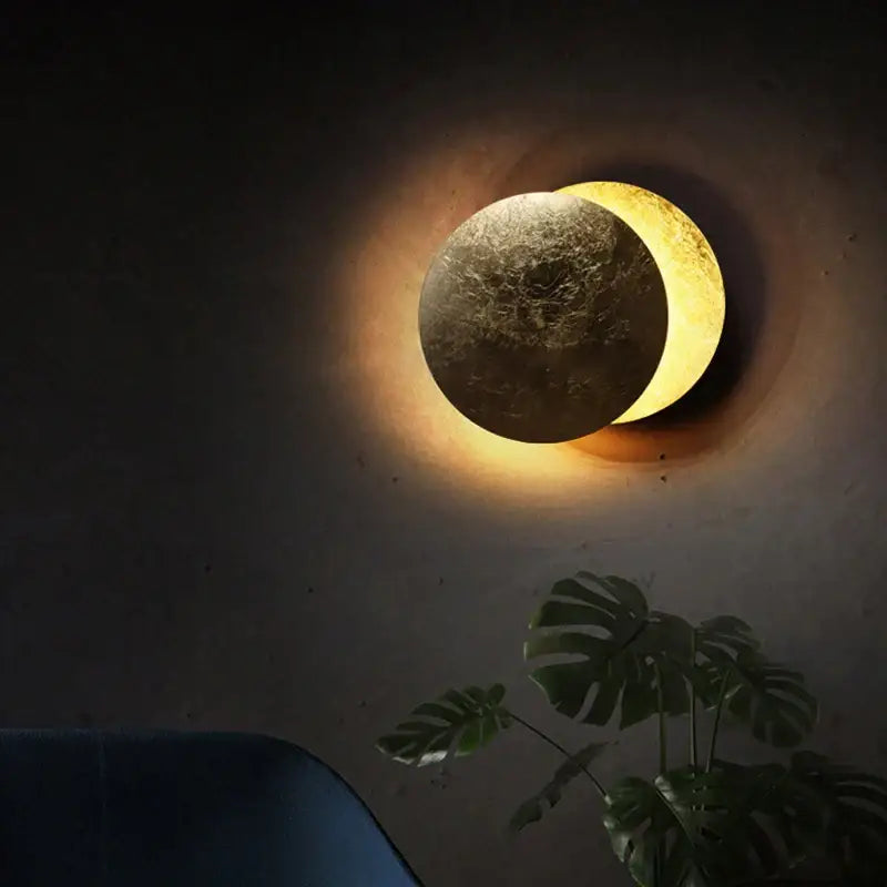 Modern textured eclipse round wall lamp with warm glowing crescent and full moon design for bedroom wall lamp