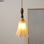 Modern textured glass copper led pendant light with warm tones dark wood handle and brass accents for kitchen dining room