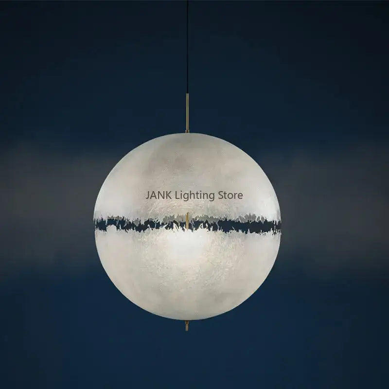 Modern textured moon pendant chandelier with matte white cracked earth design and bold black band by decorbites designer moon