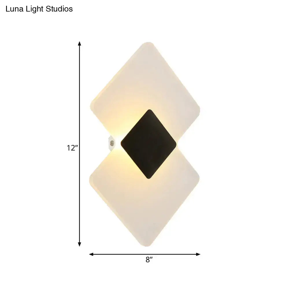 Modern textured silver and black direct wired electric wall sconce with diamond-shaped frosted white and black panels