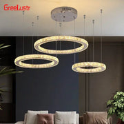 Modern three tier chrome decorbites crystal led chandelier with crystal-encrusted rings and warm ambient lighting