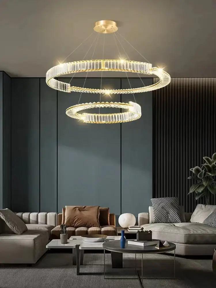 A modern double-ring crystal gold led chandelier with gold-toned finish for dining room decorbites crystal gold ring