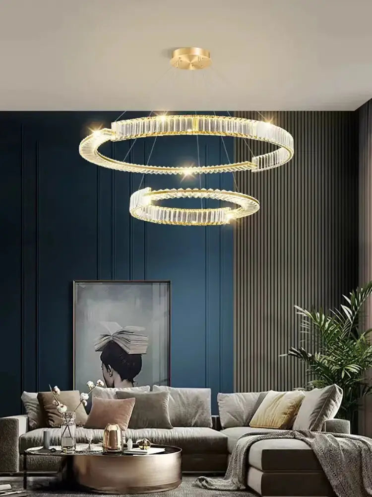 Modern three tier crystal gold ring led chandelier with clear crystal accents and gold finish for dining room decorbites crystal gold