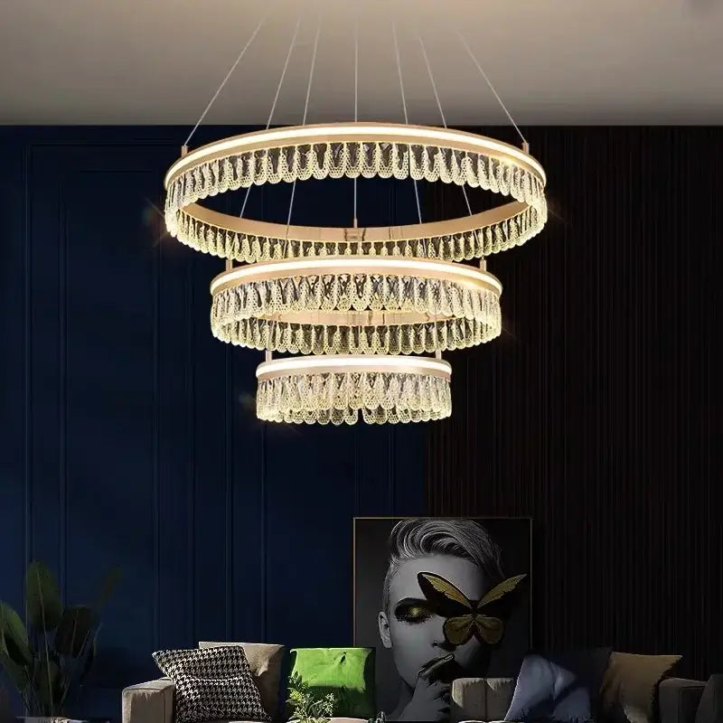 Modern three tier gold crystal led chandelier with cascading droplets and warm glow for dining room decorbites modern crystal