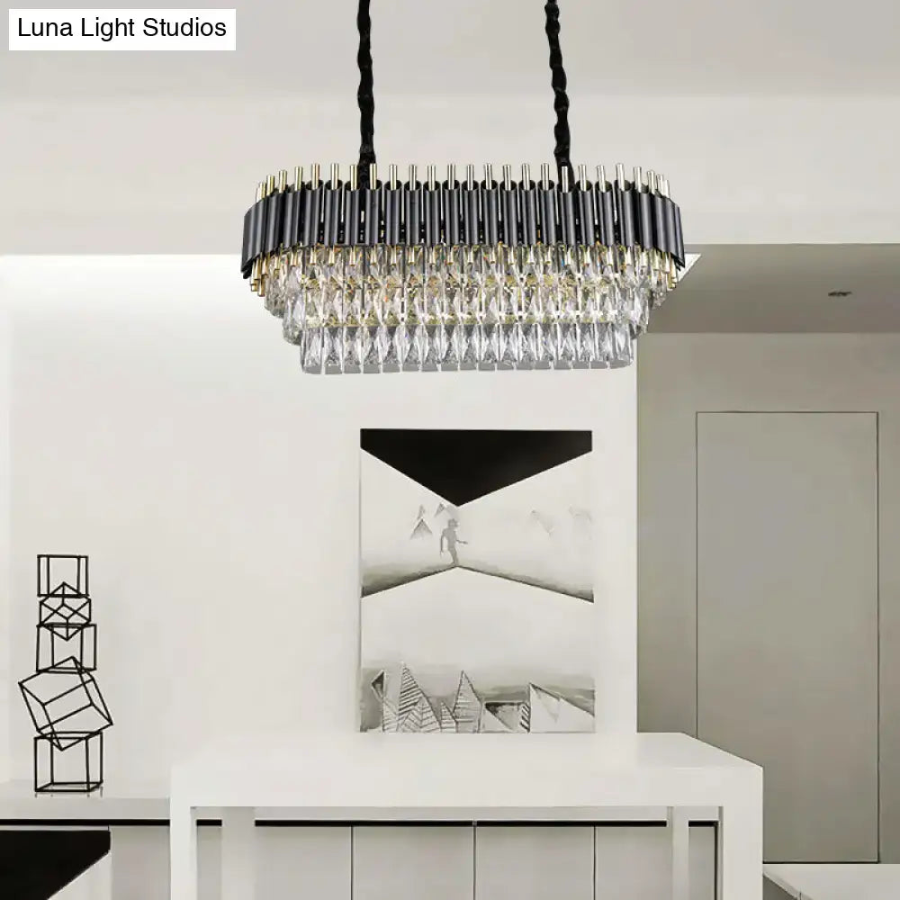 Modern tiered black and clear crystal ceiling light with gold accents in a rectangular design for kitchen island use