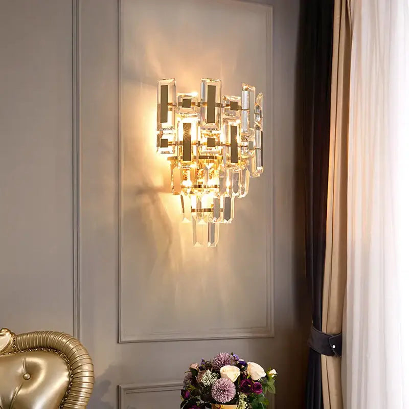 Modern tiered clear and dark crystal wall lamp with faceted glass and gold accents for bedroom decorbites crystal wall lamp