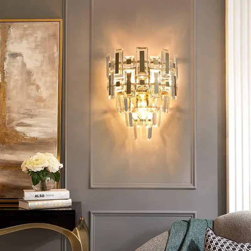 Elegant modern tiered crystal wall lamp with clear faceted crystals and gold metal accents for bedroom decorbites crystal wall